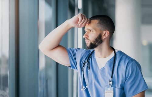 Window, doctor and man with stress, thinking and mental health with burnout, overworked and depress.